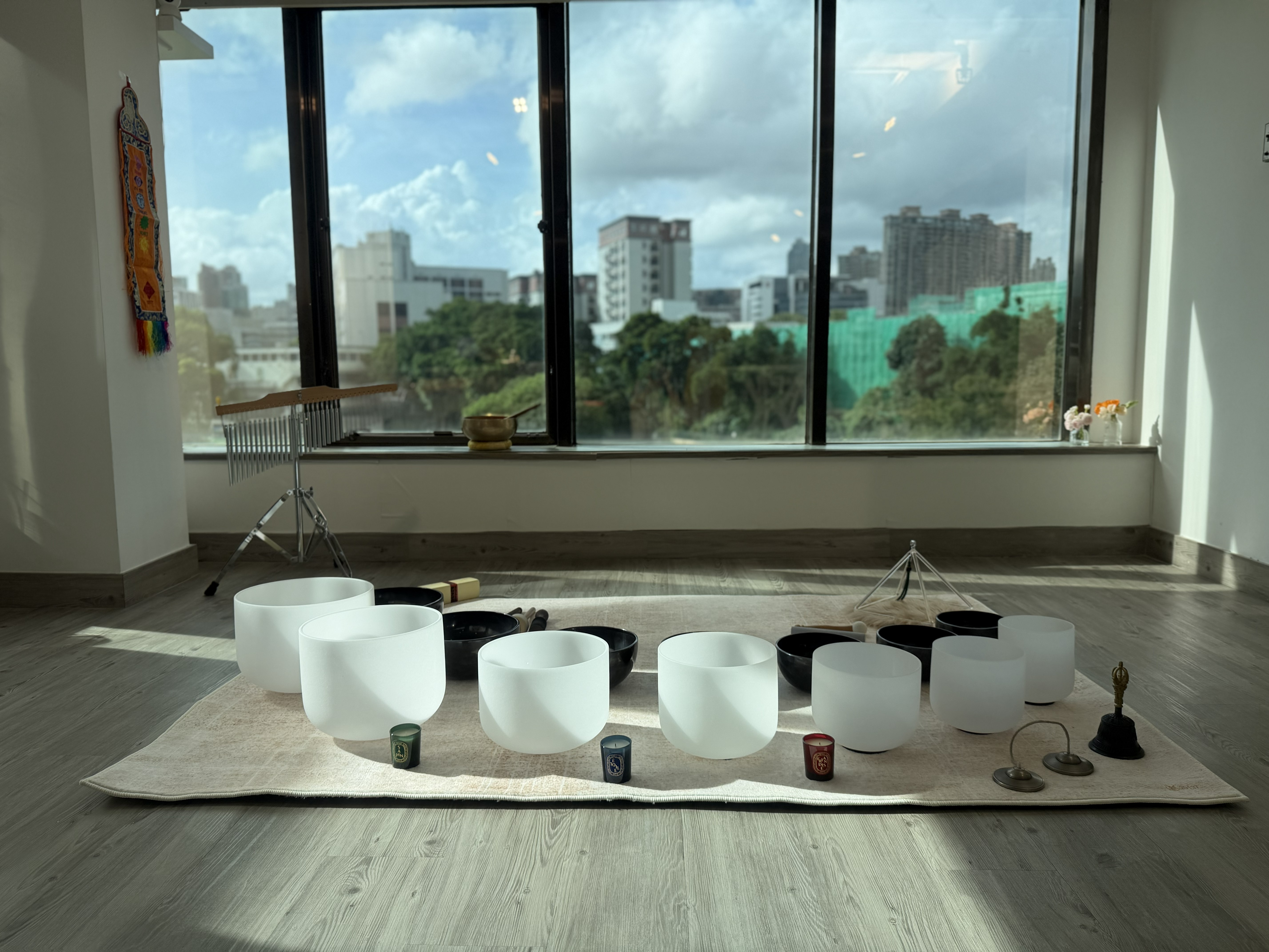 WHM studio with singing bowls in warm morning light